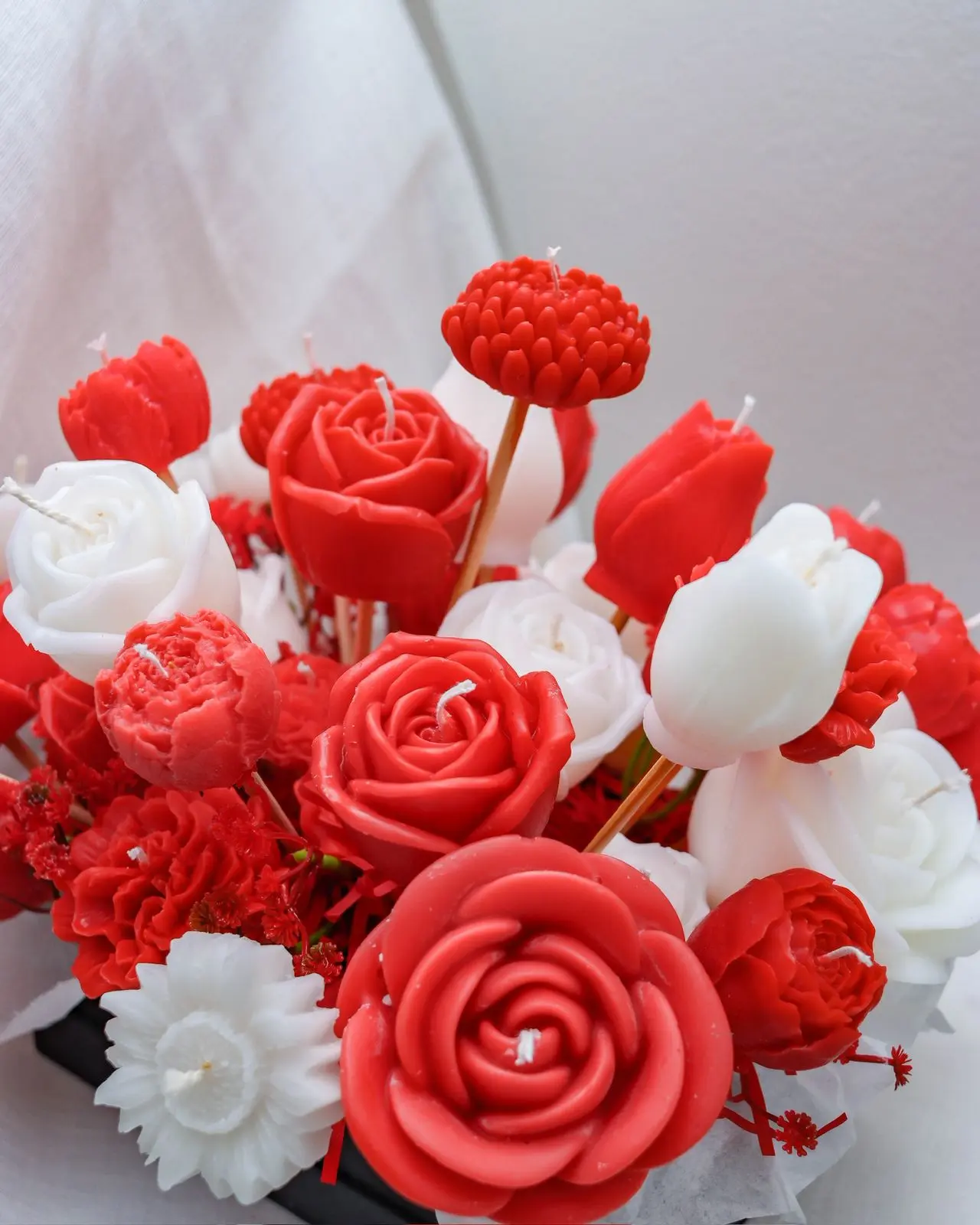 Bouquet of red and white candles.
